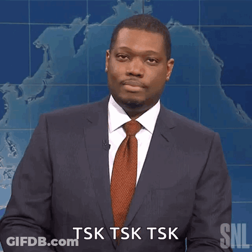 A Man In A Suit And Tie Is Saying Tsk Tsk Tsk GIF