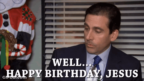 A Man In A Suit And Tie Is Saying " Well Happy Birthday Jesus " GIF