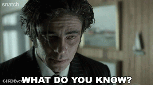 A Man In A Suit And Tie Is Saying What Do You Know GIF