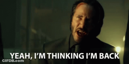 A Man In A Suit And Tie Is Saying Yeah , I 'M Thinking I 'M Back GIF