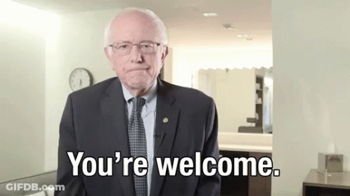 A Man In A Suit And Tie Is Saying " You 'Re Welcome " GIF
