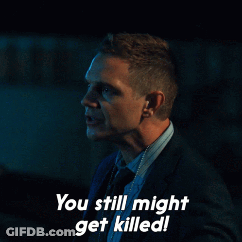 A Man In A Suit And Tie Is Saying You Still Might Get Killed GIF