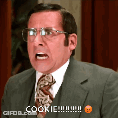 A Man In A Suit And Tie Is Screaming And Saying Cookie GIF