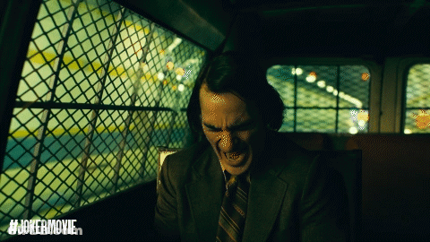 Man In Suit Screaming In Front Of Joker Movie GIF