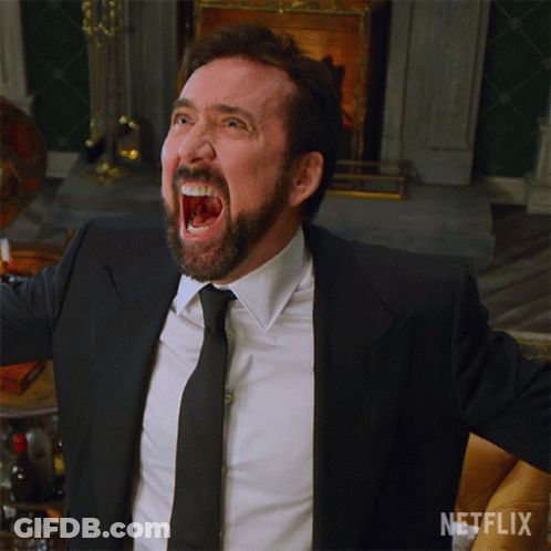 A Man In A Suit And Tie Is Screaming In Front Of A Fireplace With A Netflix Logo In The Corner GIF