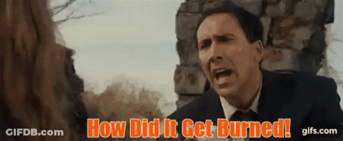 A Man In A Suit And Tie Is Screaming In Front Of A Stone Wall . GIF