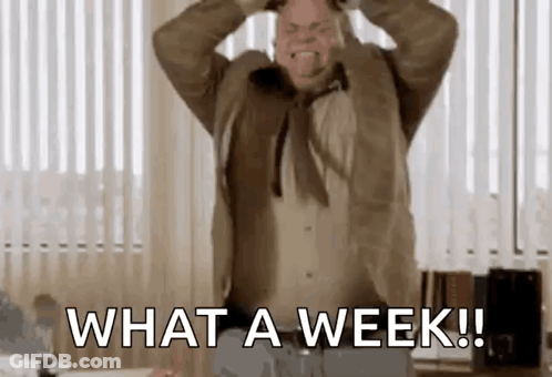 A Man In A Suit And Tie Is Screaming With His Hands On His Head And Says `` What A Week ! '' GIF