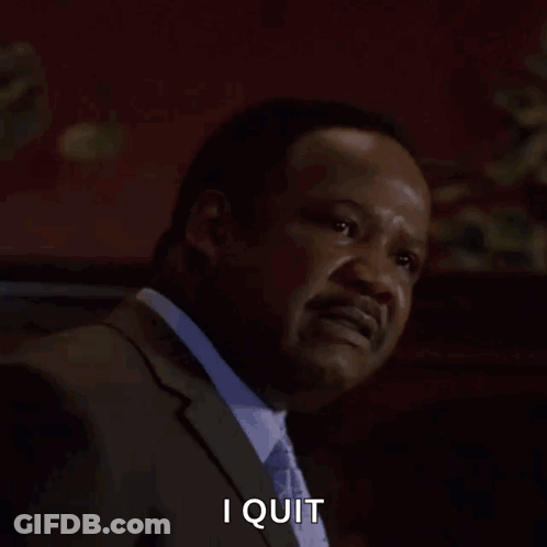 A Man In A Suit And Tie Is Screaming With The Words I Quit Behind Him GIF