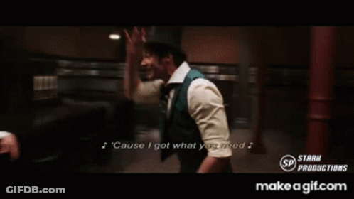 A Man In A Suit And Tie Is Singing A Song Called Cause I Got What You Need GIF