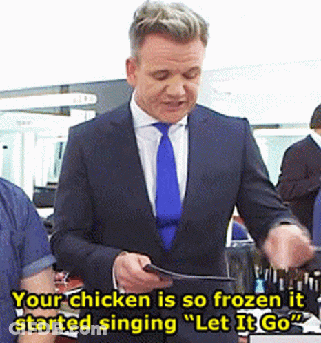 A Man In A Suit And Tie Is Singing Let It Go GIF