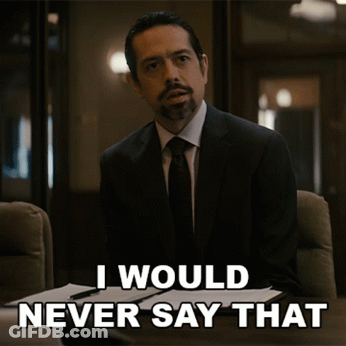 A Man In A Suit And Tie Is Sitting At A Desk And Says I Would Never Say That GIF