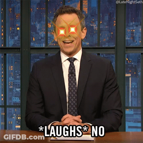 Man In Suit Saying Laughs No At Desk GIF
