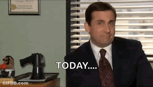 A Man In A Suit And Tie Is Sitting At A Desk In Front Of A Window And Saying Today . GIF