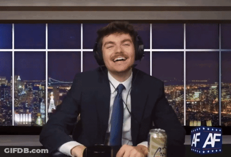 A Man In A Suit And Tie Is Sitting At A Desk With A Can Of Beer And A Sign That Says Af Af GIF