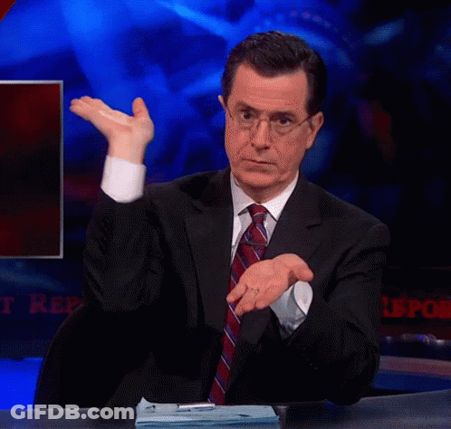 A Man In A Suit And Tie Is Sitting At A Desk With A Sign That Says ' Reports ' GIF