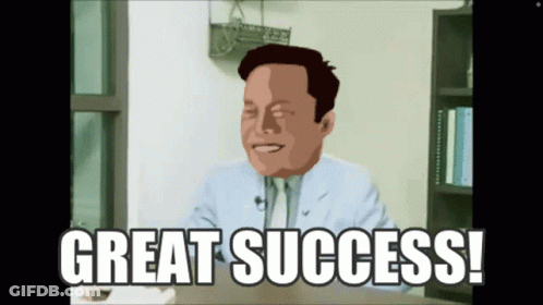 A Man In A Suit And Tie Is Sitting At A Desk With The Words Great Success Below Him GIF