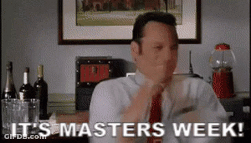 A Man In A Suit And Tie Is Sitting At A Table And Says It 'S Masters Week . GIF