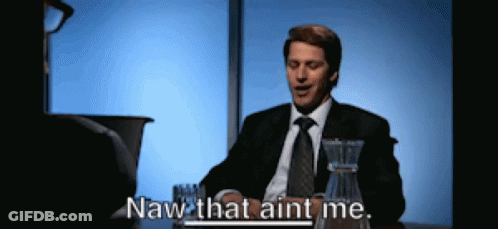 A Man In A Suit And Tie Is Sitting At A Table And Says Naw That Aint Me GIF
