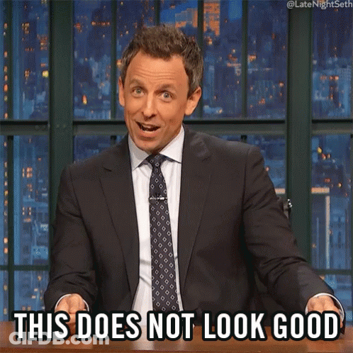 A Man In A Suit And Tie Is Sitting At A Table And Says This Does Not Look Good GIF