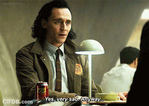 A Man In A Suit And Tie Is Sitting At A Table With A Can Of Soda And Says Yes Very Sad Anyway .. GIF