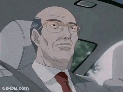 A Man In A Suit And Tie Is Sitting In A Car . GIF