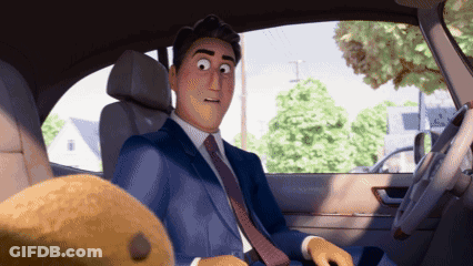A Man In A Suit And Tie Is Sitting In A Car Next To A Teddy Bear GIF