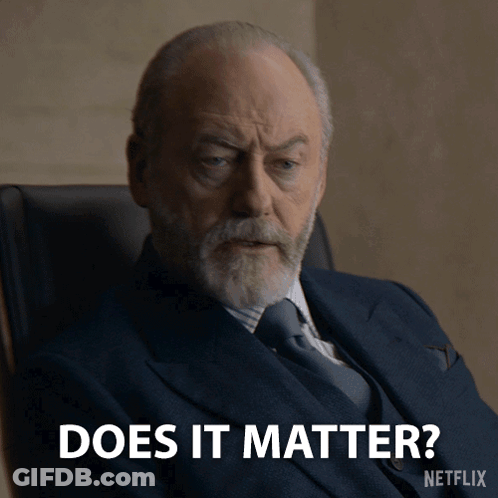 Man In Suit Sitting And Saying Does It Matter GIF