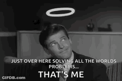 A Man In A Suit And Tie Is Sitting In A Chair With A Halo On His Head . GIF