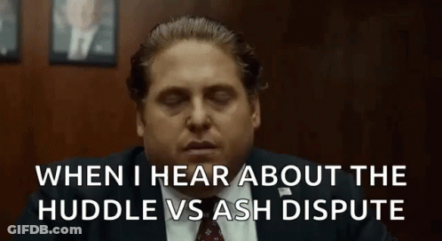 A Man In A Suit And Tie Is Sitting In A Room With His Eyes Closed And A Quote . GIF