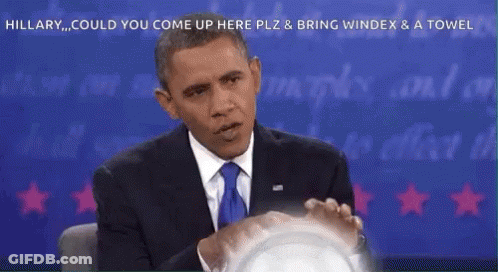 A Man In A Suit And Tie Is Sitting In Front Of A Blue Background With The Words Hillary Could You Come Up Here GIF