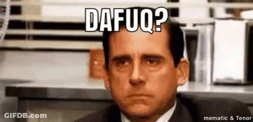 A Man In A Suit And Tie Is Sitting In Front Of A Computer Screen With A Caption That Says Dafuq ? GIF