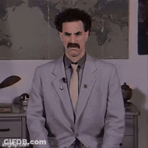 A Man In A Suit And Tie Is Sitting In Front Of A Map And Says No ! GIF