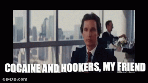 A Man In A Suit And Tie Is Sitting In Front Of A Window And Says Cocaine And Hookers My Friend GIF