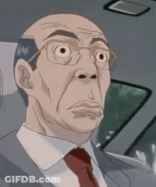 A Man In A Suit And Tie Is Sitting In The Back Seat Of A Car Making A Funny Face . GIF