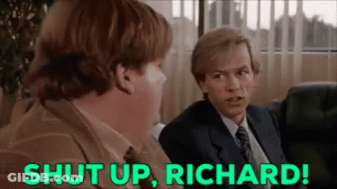 A Man In A Suit And Tie Is Sitting Next To Another Man In A Chair And Says `` Shut Up , Richard '' . GIF