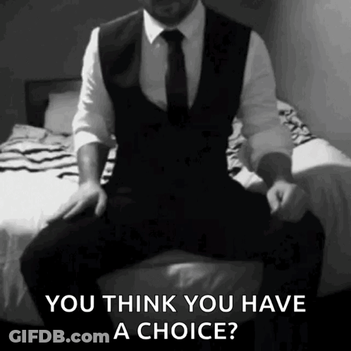 A Man In A Suit And Tie Is Sitting On A Bed And Says You Think You Have A Choice ? GIF