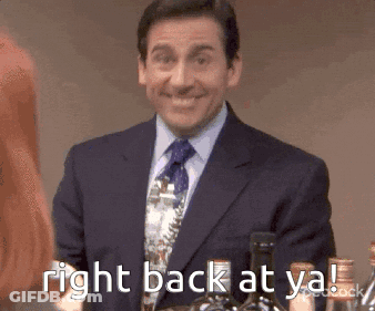 A Man In A Suit And Tie Is Smiling And Holding A Bottle Of Wine . GIF