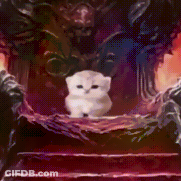 A Man In A Suit And Tie Is Smiling And Looking At The Camera GIF