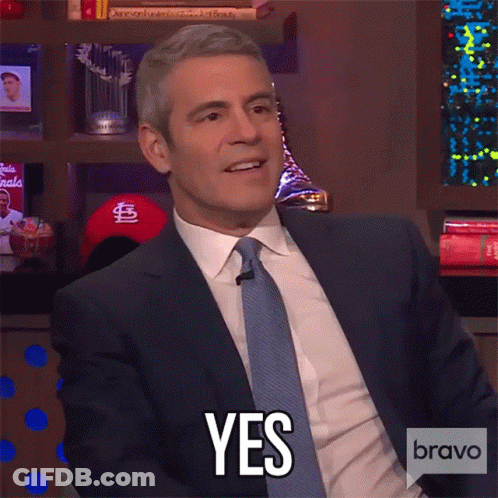 Man In Suit Smiling And Saying Yes GIF