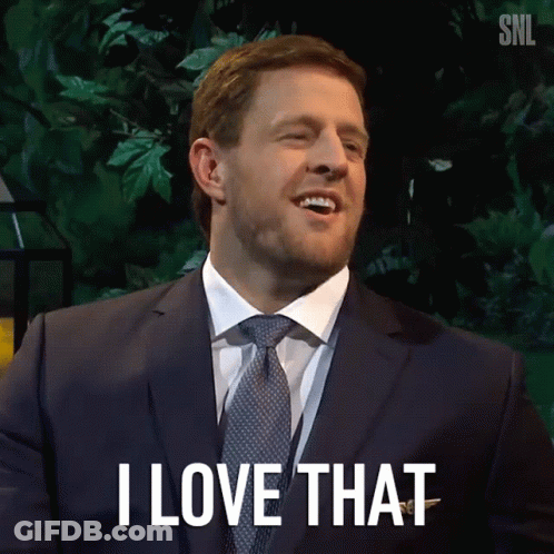 A Man In A Suit And Tie Is Smiling And Says I Love That GIF