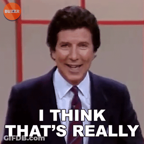 A Man In A Suit And Tie Is Smiling And Says I Think That 'S Really GIF
