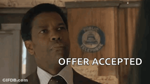 Smiling Man In Suit And Tie Says Offer Accepted GIF