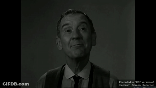 A Man In A Suit And Tie Is Smiling In A Free Version Of Icecream Screen Recorder GIF