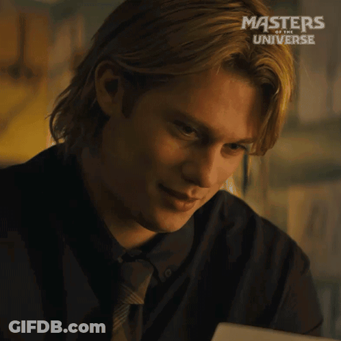 A Man In A Suit And Tie Is Smiling In A Masters Of The Universe Advertisement GIF