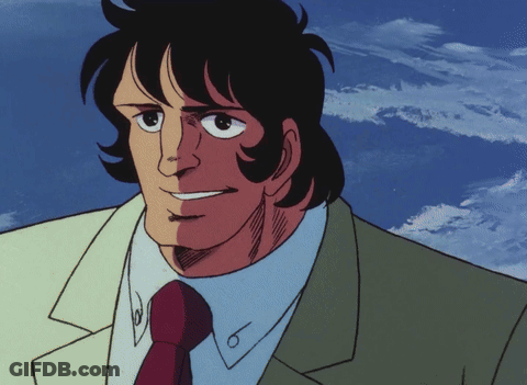 Smiling Man In Suit And Tie In Front Of Clouds GIF