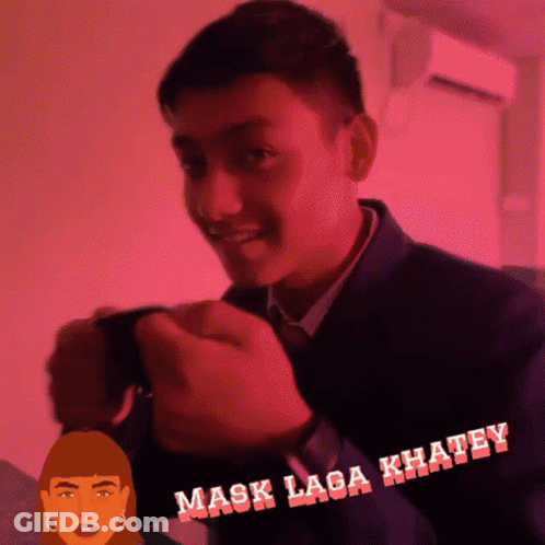 A Man In A Suit And Tie Is Smiling In Front Of A Pink Background That Says " Mask Laga Khaley " GIF
