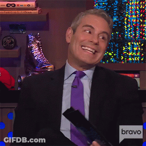 Smiling Man In Suit And Tie With Bravo Sign GIF