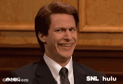 Man In Suit Making Funny Face GIF