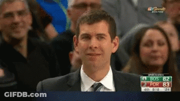 A Man In A Suit And Tie Is Smiling While Watching A Game On Nbc Sports GIF