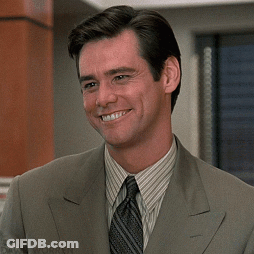 A Man In A Suit And Tie Is Smiling With David Worren Written On The Bottom Right GIF